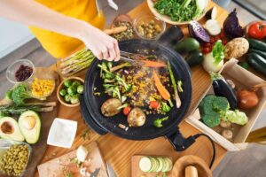 Preparing a delicious vegan meal in an electric frying pan